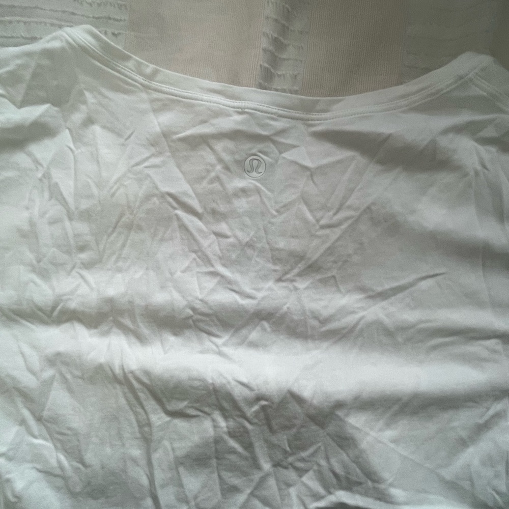 Lululemon white vneck cropped tie tshirt. Pima cotton. Worn once. Size 4.